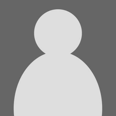 Placeholder image signifying a person's headshot with a dark gray background and a lighter gray outline of a body.